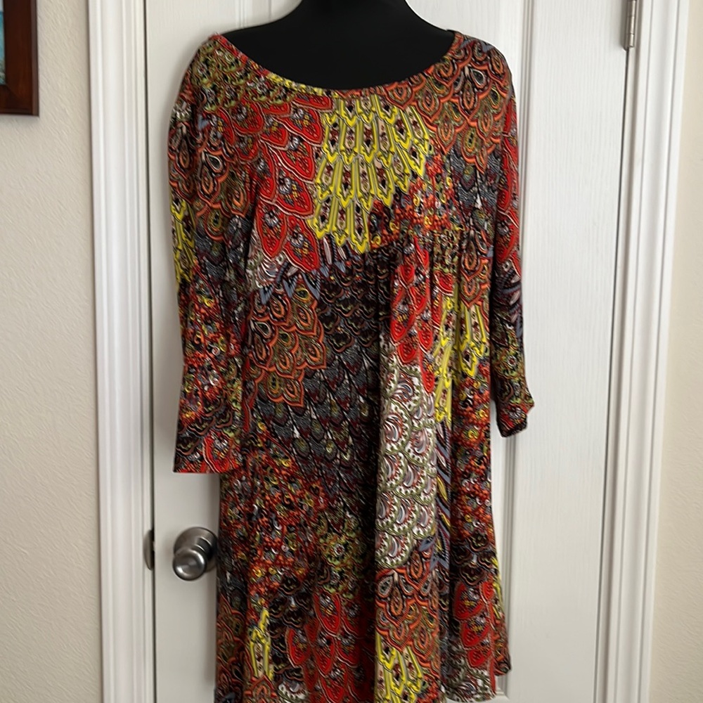 Mini dress or long tunic.  Paisley print.  Polyester and spandex.